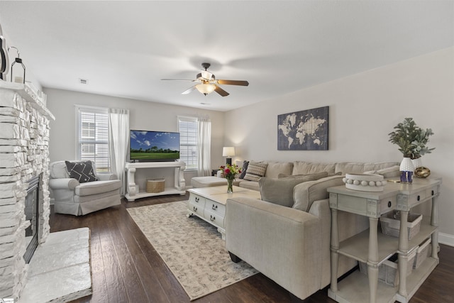 125 Saxon Falls Ct, Greenville, SC 29607 - living room with ceiling fan, dark wood-style floors, and a stone fireplace
