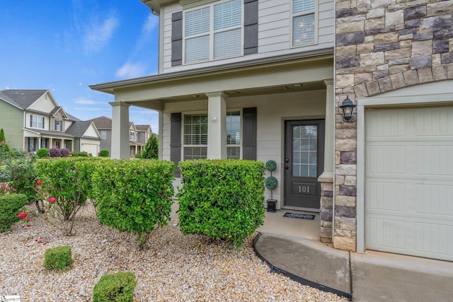 101 Kings Heath Ln, Simpsonville, SC 29680 - view of exterior entry featuring a porch, a garage, and stone siding