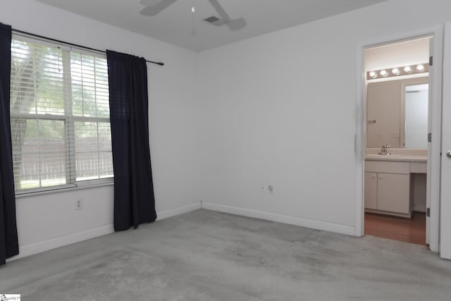 7 Pergola Pl, Simpsonville, SC 29680 - unfurnished bedroom with light colored carpet, a sink, connected bathroom, and baseboards