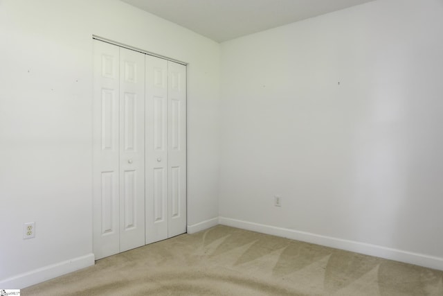 7 Pergola Pl, Simpsonville, SC 29680 - unfurnished bedroom featuring light carpet, baseboards, and a closet