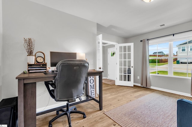 7110 Luna Mae Ct, Boiling Springs, SC 29316 - home office with french doors, wood finished floors, and baseboards