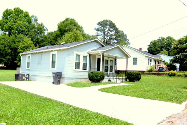 210 Mcdowell St, Laurens, SC 29360 - single story home featuring covered porch, a front yard, and central air condition unit