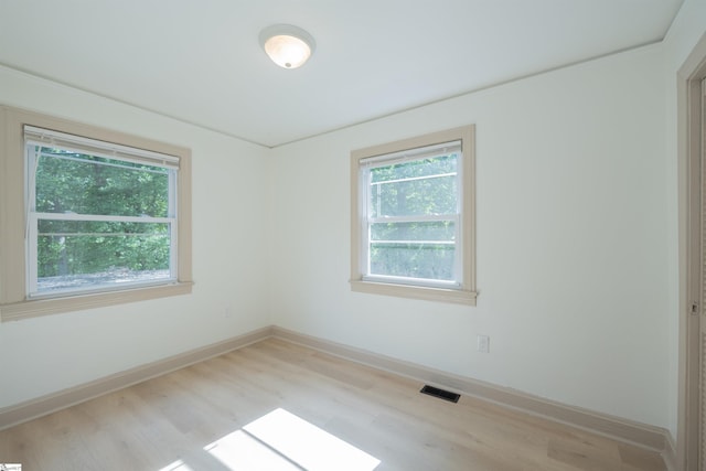 32 Essex Ct, Greenville, SC 29609 - empty room with wood finished floors and baseboards