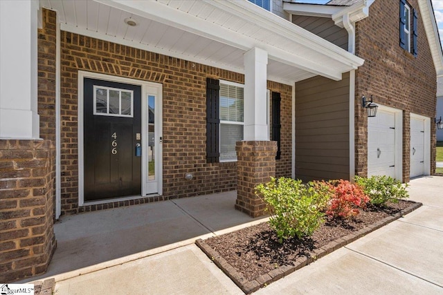 466 Fox Run Trl, Woodruff, SC 29388 - view of exterior entry with covered porch, brick siding, and concrete driveway