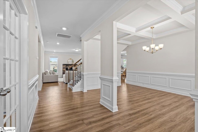 466 Fox Run Trl, Woodruff, SC 29388 - entryway featuring wood finished floors, stairs, a decorative wall, a chandelier, and crown molding