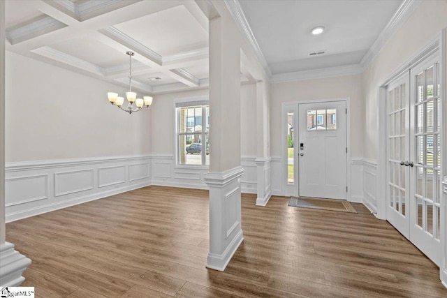 466 Fox Run Trl, Woodruff, SC 29388 - foyer entrance featuring a chandelier, beamed ceiling, wood finished floors, coffered ceiling, and a wainscoted wall