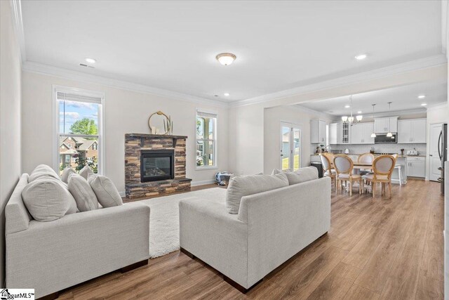 466 Fox Run Trl, Woodruff, SC 29388 - living area featuring plenty of natural light, wood finished floors, a fireplace, recessed lighting, and ornamental molding