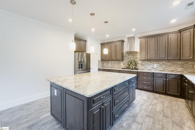 740 N Alamosa Dr, Boiling Springs, SC 29316 - kitchen featuring appliances with stainless steel finishes, wall chimney exhaust hood, ornamental molding, light wood-style floors, and backsplash