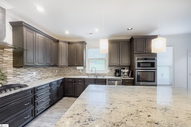 740 N Alamosa Dr, Boiling Springs, SC 29316 - kitchen with stainless steel appliances, a sink, wall chimney range hood, ornamental molding, and dark brown cabinetry
