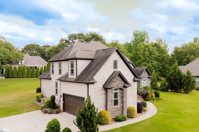 740 N Alamosa Dr, Boiling Springs, SC 29316 - french country style house featuring concrete driveway, a garage, a front yard, and a shingled roof