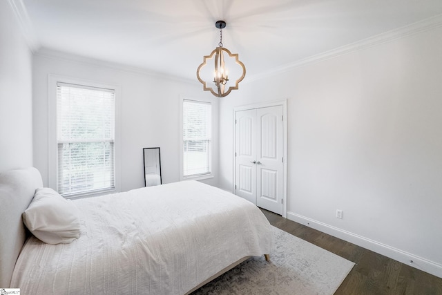 740 N Alamosa Dr, Boiling Springs, SC 29316 - bedroom with a chandelier, ornamental molding, baseboards, dark wood-style flooring, and a closet