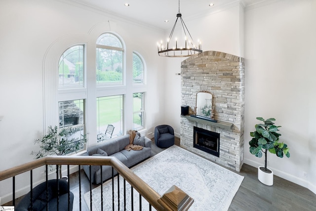 740 N Alamosa Dr, Boiling Springs, SC 29316 - living room with a chandelier, wood finished floors, a fireplace, baseboards, and crown molding