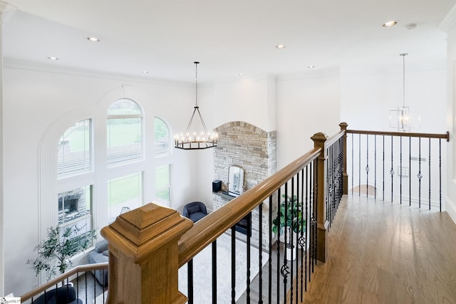 740 N Alamosa Dr, Boiling Springs, SC 29316 - hallway with a chandelier, wood finished floors, an upstairs landing, recessed lighting, and crown molding