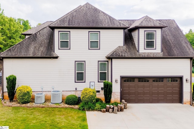 740 N Alamosa Dr, Boiling Springs, SC 29316 - view of front of home with roof with shingles, a front yard, driveway, and central AC