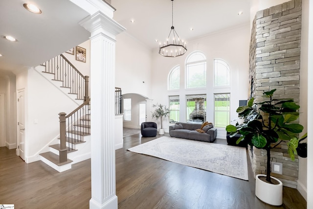 740 N Alamosa Dr, Boiling Springs, SC 29316 - entrance foyer featuring ornate columns, arched walkways, stairway, wood finished floors, and crown molding