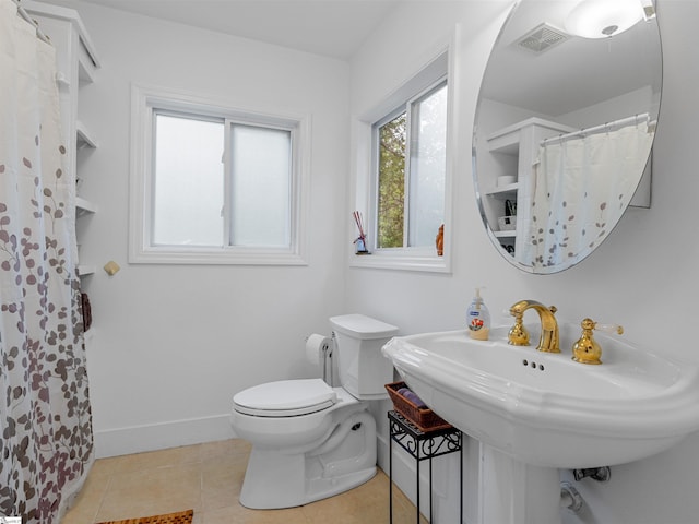 380 Montagu Dr, Spartanburg, SC 29301 - full bathroom featuring toilet, tile patterned flooring, baseboards, a sink, and curtained shower