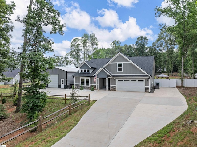 197 Falling Creek Rd, Spartanburg, SC 29301 - craftsman house featuring stone siding, concrete driveway, a gate, and roof with shingles