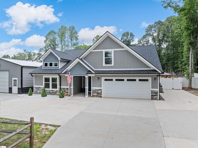 197 Falling Creek Rd, Spartanburg, SC 29301 - craftsman house featuring concrete driveway, a shingled roof, and stone siding