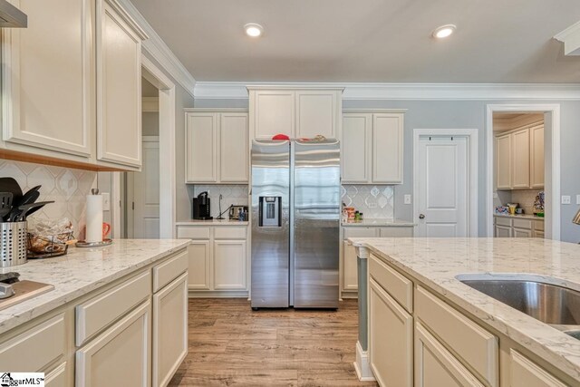 2 Stony Run Ln, Simpsonville, SC 29681 - kitchen featuring stainless steel fridge, decorative backsplash, light wood-style flooring, light stone counters, and recessed lighting