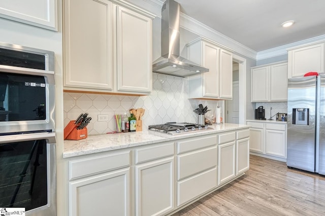2 Stony Run Ln, Simpsonville, SC 29681 - kitchen with appliances with stainless steel finishes, wall chimney exhaust hood, tasteful backsplash, white cabinets, and ornamental molding