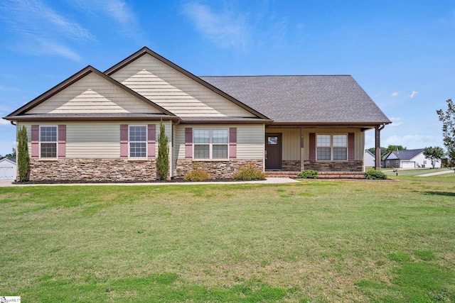 157 Deyoung Meadows Dr, Greer, SC 29651 - craftsman-style home featuring stone siding, a front lawn, a porch, and roof with shingles
