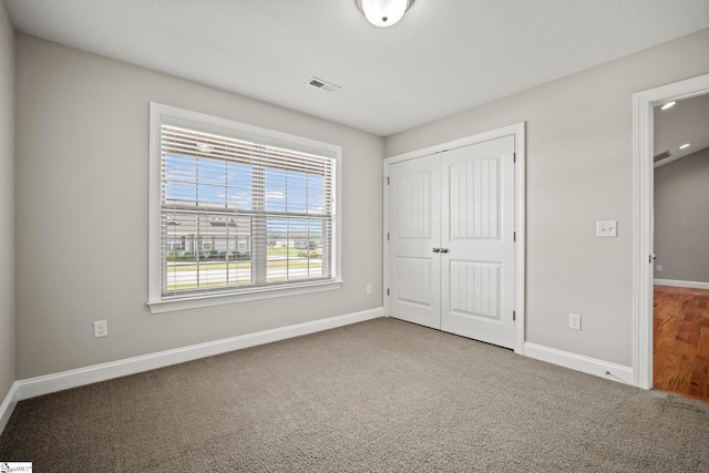 157 Deyoung Meadows Dr, Greer, SC 29651 - unfurnished bedroom featuring baseboards, a closet, and carpet