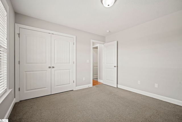 157 Deyoung Meadows Dr, Greer, SC 29651 - unfurnished bedroom featuring carpet floors, baseboards, and a closet