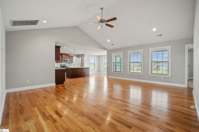 157 Deyoung Meadows Dr, Greer, SC 29651 - unfurnished living room featuring a ceiling fan, healthy amount of natural light, high vaulted ceiling, light wood finished floors, and baseboards
