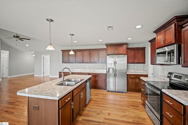 157 Deyoung Meadows Dr, Greer, SC 29651 - kitchen featuring appliances with stainless steel finishes, a sink, light wood-type flooring, ceiling fan, and light countertops