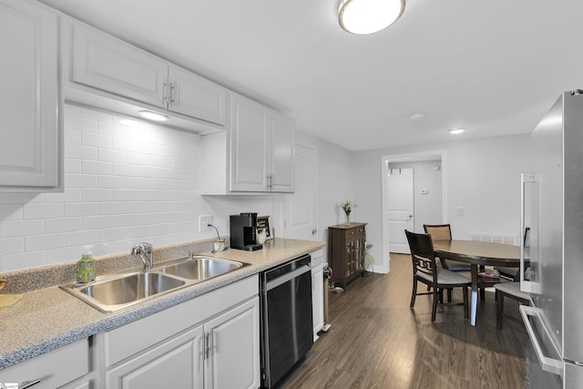 316 W Blue Ridge St, Pendleton, SC 29670 - kitchen featuring appliances with stainless steel finishes, a sink, dark wood-style flooring, white cabinets, and decorative backsplash