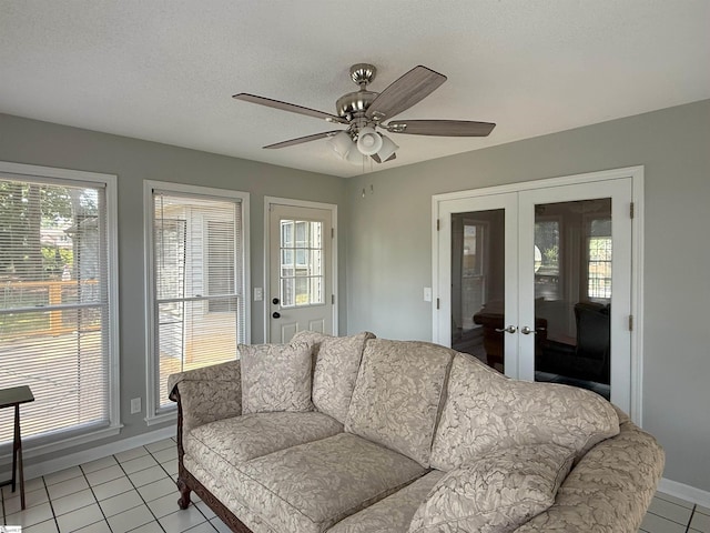 111 Firethorne Ct, Greer, SC 29650 - living room featuring french doors, light tile patterned floors, ceiling fan, and baseboards