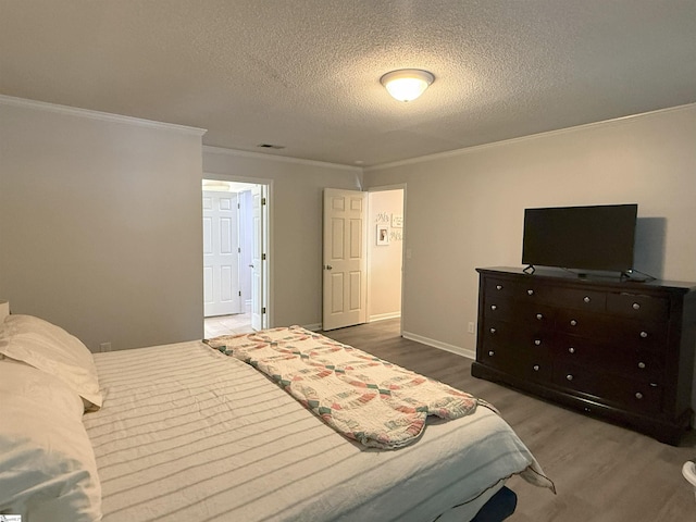 111 Firethorne Ct, Greer, SC 29650 - bedroom with ornamental molding, a textured ceiling, wood finished floors, and baseboards