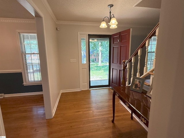 111 Firethorne Ct, Greer, SC 29650 - entryway with a chandelier, wood finished floors, plenty of natural light, stairway, and a textured ceiling