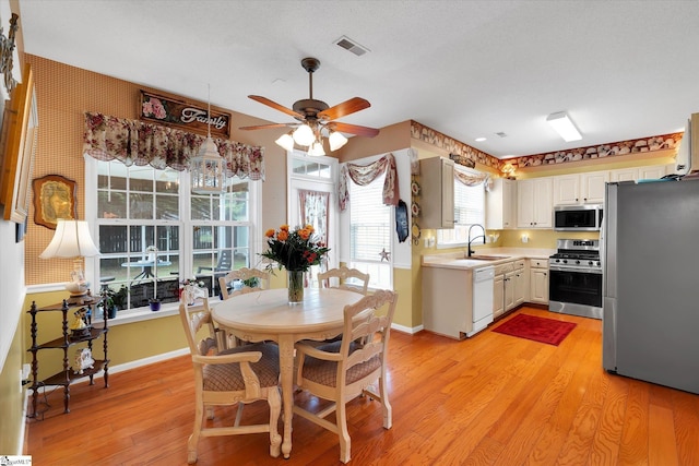 532 Cardinal Woods Way, Easley, SC 29642 - dining area featuring ceiling fan, light wood finished floors, and baseboards