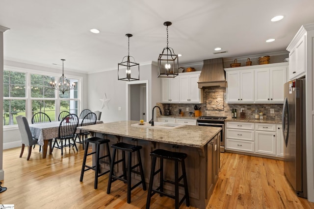 105 Tall Oaks Ct, Easley, SC 29642 - kitchen with stainless steel appliances, custom exhaust hood, a sink, crown molding, and backsplash