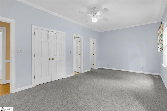 107 Cinder Creek Ln, Spartanburg, SC 29307 - unfurnished bedroom with carpet flooring, crown molding, baseboards, and a closet