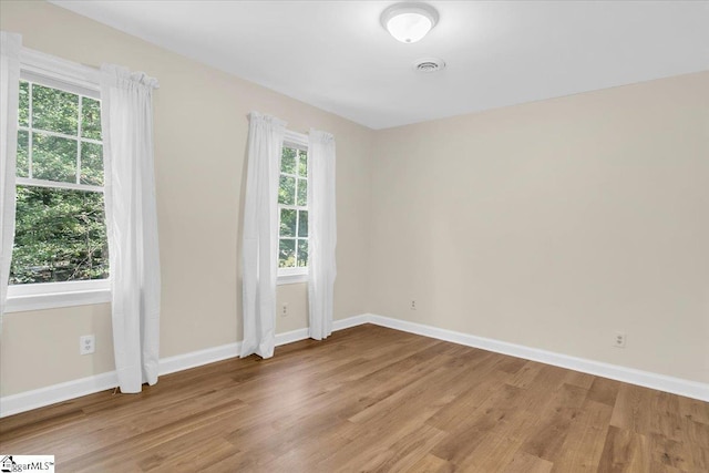 107 Cinder Creek Ln, Spartanburg, SC 29307 - spare room featuring healthy amount of natural light, light wood finished floors, and baseboards