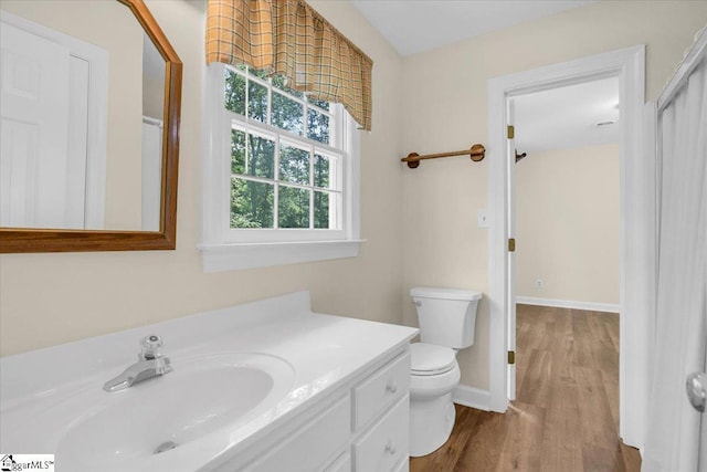 107 Cinder Creek Ln, Spartanburg, SC 29307 - bathroom with toilet, vanity, wood finished floors, and baseboards