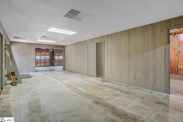 107 Cinder Creek Ln, Spartanburg, SC 29307 - unfurnished room with a paneled ceiling, wooden walls, and concrete floors