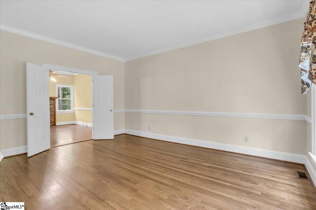 107 Cinder Creek Ln, Spartanburg, SC 29307 - empty room with wood finished floors, ornamental molding, baseboards, and a ceiling fan