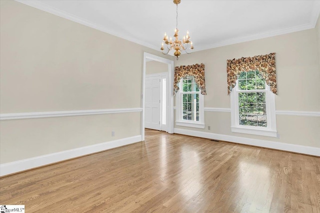 107 Cinder Creek Ln, Spartanburg, SC 29307 - unfurnished room with a chandelier, wood finished floors, crown molding, and baseboards