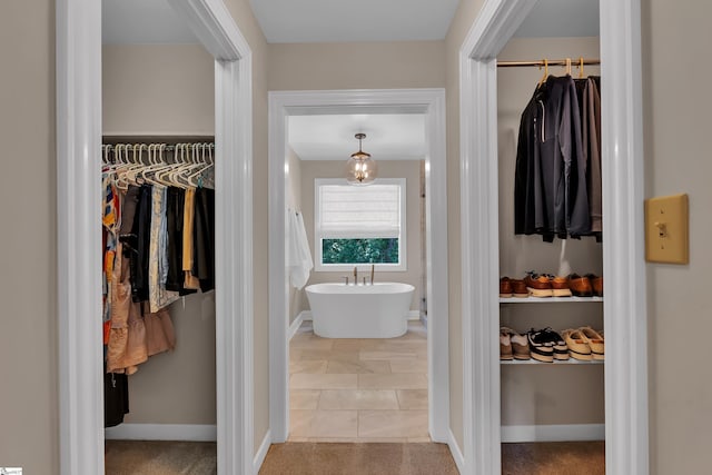103 Brandon Way, Simpsonville, SC 29681 - full bath with a walk in closet, a soaking tub, and baseboards