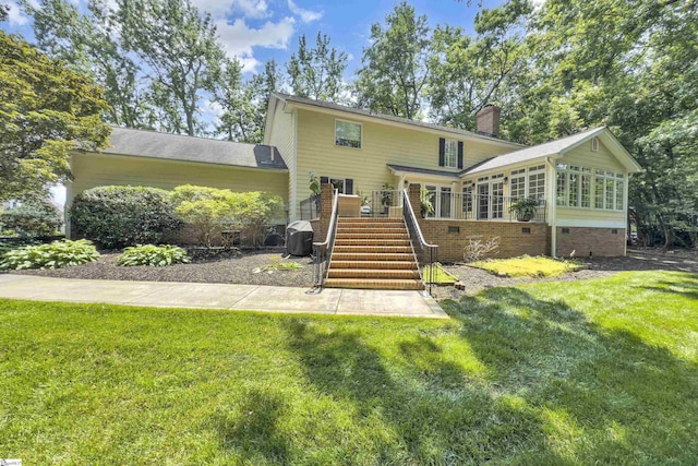 103 Brandon Way, Simpsonville, SC 29681 - rear view of house featuring a sunroom, a lawn, a chimney, and stairway