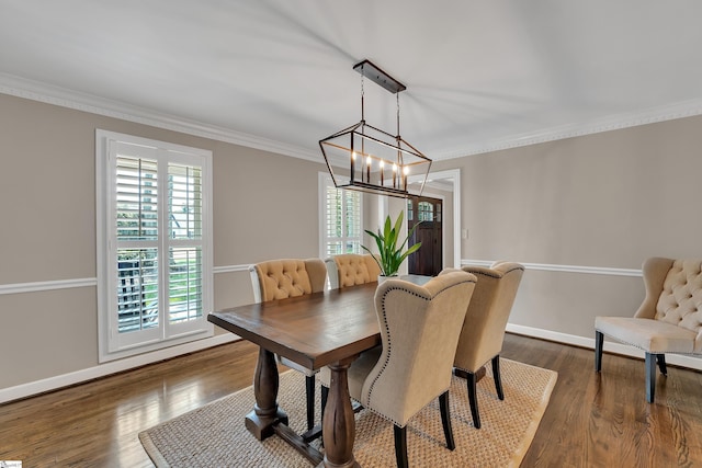 103 Brandon Way, Simpsonville, SC 29681 - dining space featuring crown molding, a chandelier, baseboards, and dark wood-style flooring