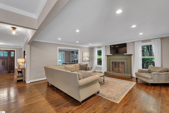 103 Brandon Way, Simpsonville, SC 29681 - living room with crown molding, dark wood-style flooring, a brick fireplace, recessed lighting, and baseboards