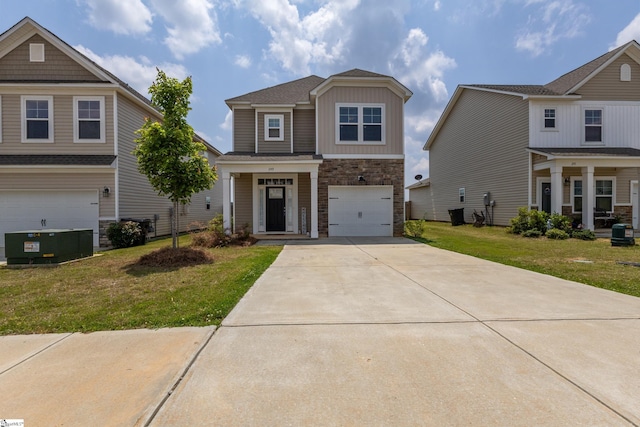 249 Samuel St, Pendleton, SC 29670 - craftsman house featuring stone siding, a front yard, concrete driveway, board and batten siding, and an attached garage