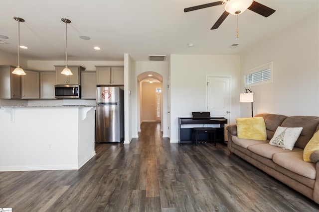 249 Samuel St, Pendleton, SC 29670 - living room with arched walkways, a ceiling fan, dark wood-style flooring, recessed lighting, and baseboards