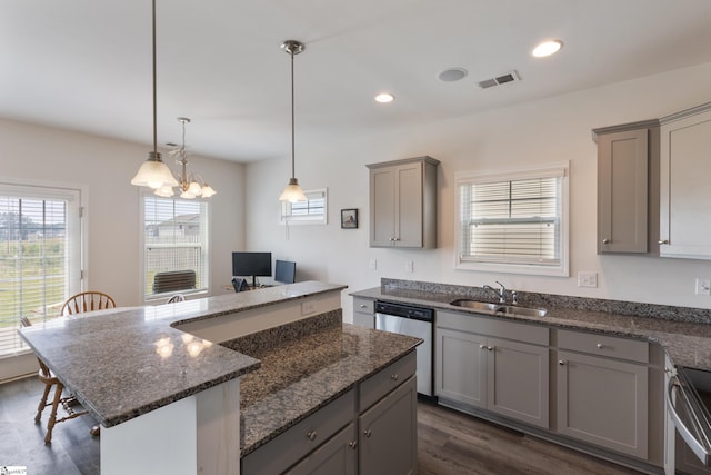 249 Samuel St, Pendleton, SC 29670 - kitchen featuring gray cabinets, stainless steel appliances, a sink, dark wood finished floors, and a breakfast bar area