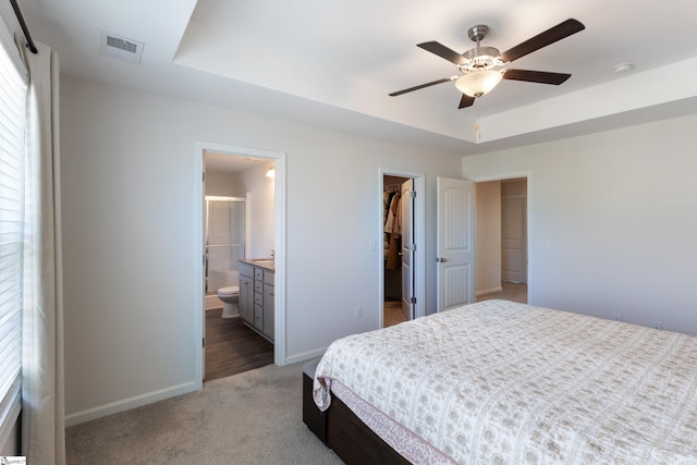 249 Samuel St, Pendleton, SC 29670 - bedroom featuring a walk in closet, baseboards, light carpet, and a closet