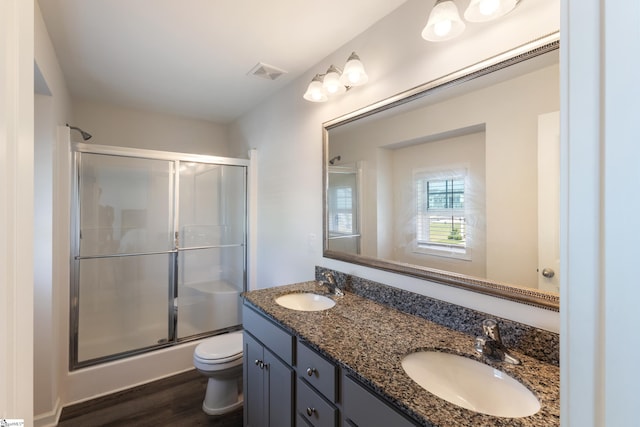 249 Samuel St, Pendleton, SC 29670 - full bathroom with toilet, a shower with door, double vanity, and wood finished floors